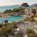 KI-Visualisierung für Iberostar Selection Albufera Park mit Pools, Wasserrutschen und direkter Strandlage